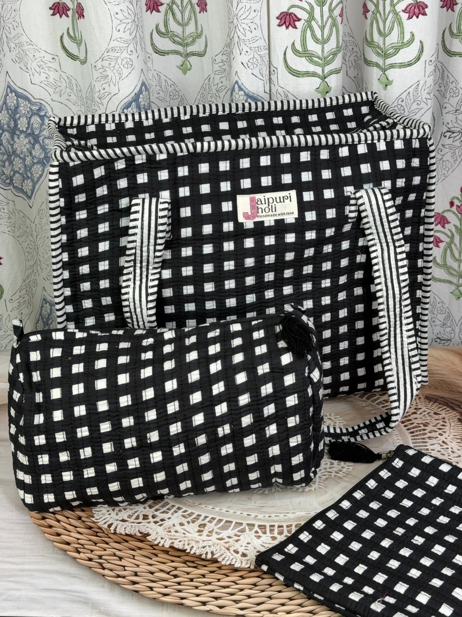 Jaipur block print medium cotton quilted zip tote bag with matching toiletry pouch and flat pouch, black and white geometric check print, 15 × 12 × 6 inch tote, 10 × 6 inch toiletry pouch and 9 × 7 inch flat pouch back view