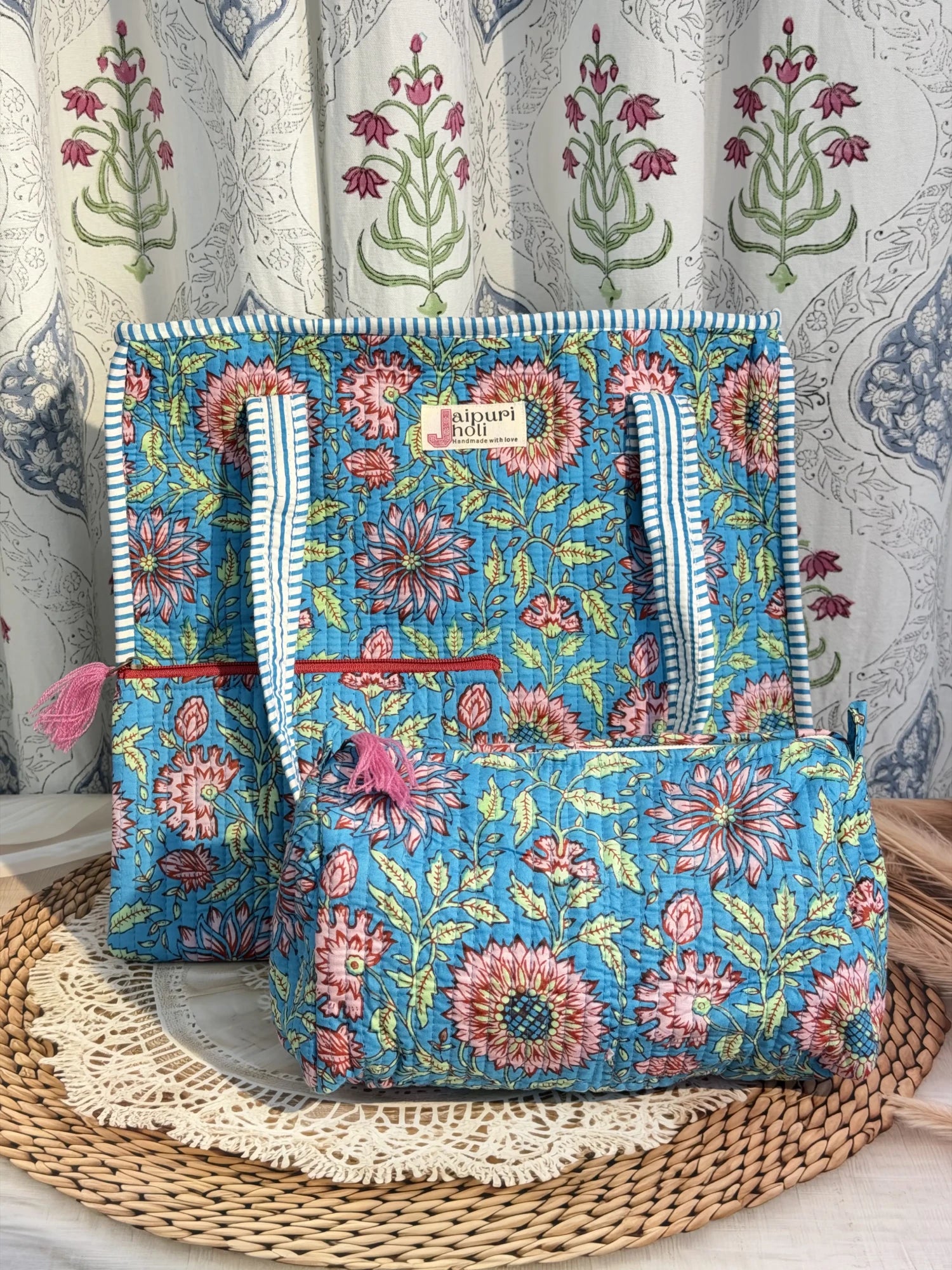 Jaipur block print medium cotton quilted zip tote bag with matching toiletry pouch and flat pouch, blue floral print, 15 × 12 × 6 inch tote, 10 × 6 inch toiletry pouch and 9 × 7 inch flat pouch front view