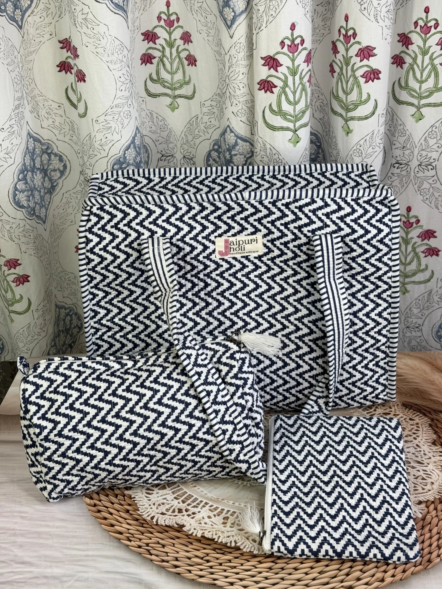 Jaipur block print medium cotton quilted zip tote bag with matching toiletry pouch and flat pouch, blue and white geometric zigzag print, 15 × 12 × 6 inch tote, 10 × 6 inch toiletry pouch and 9 × 7 inch flat pouch interior view