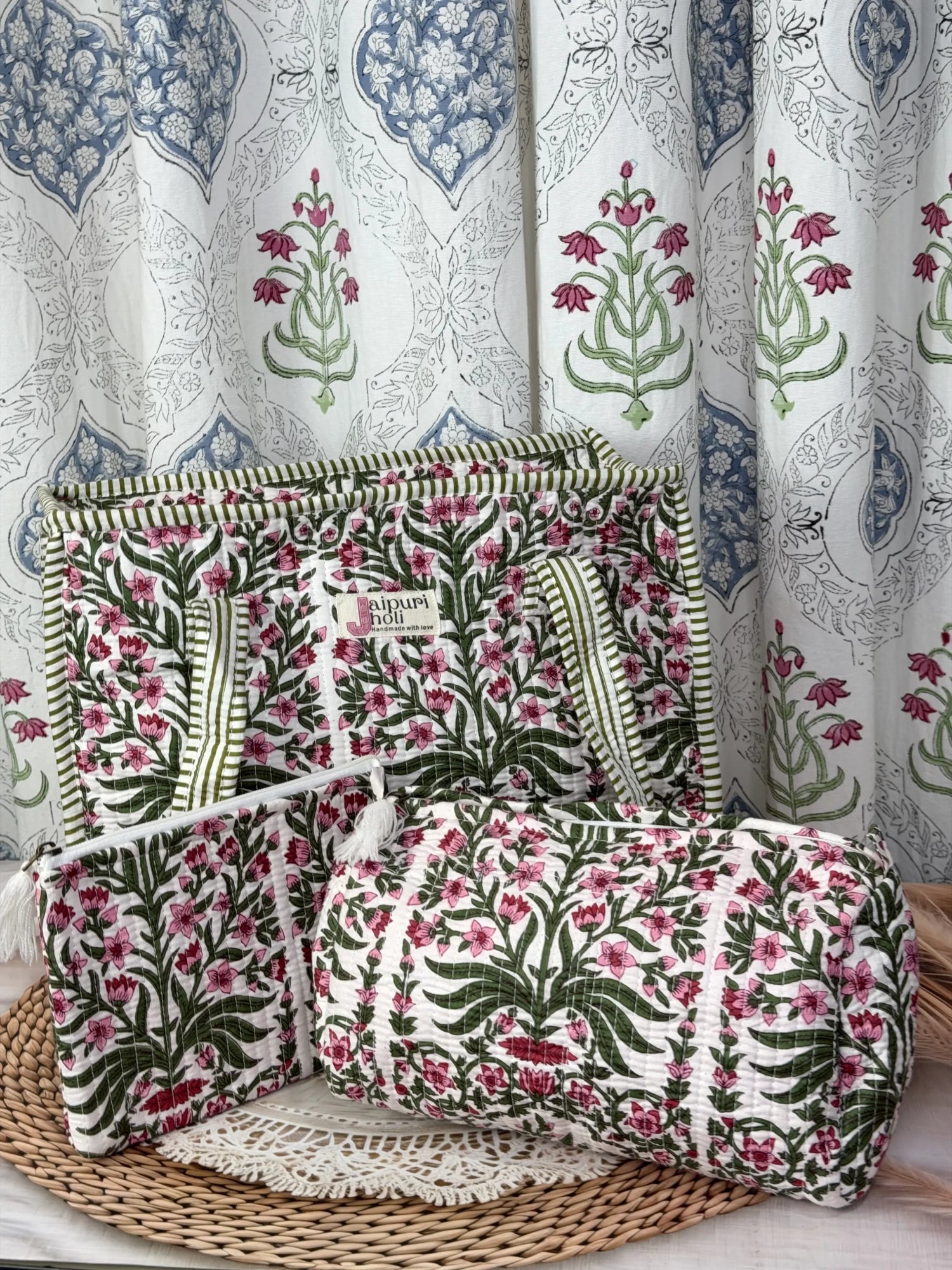 Jaipur block print medium cotton quilted zip tote bag with matching toiletry pouch and flat pouch, pink floral and green leaf print, 15 × 12 × 6 inch tote, 10 × 6 inch toiletry pouch and 9 × 7 inch flat pouch front view