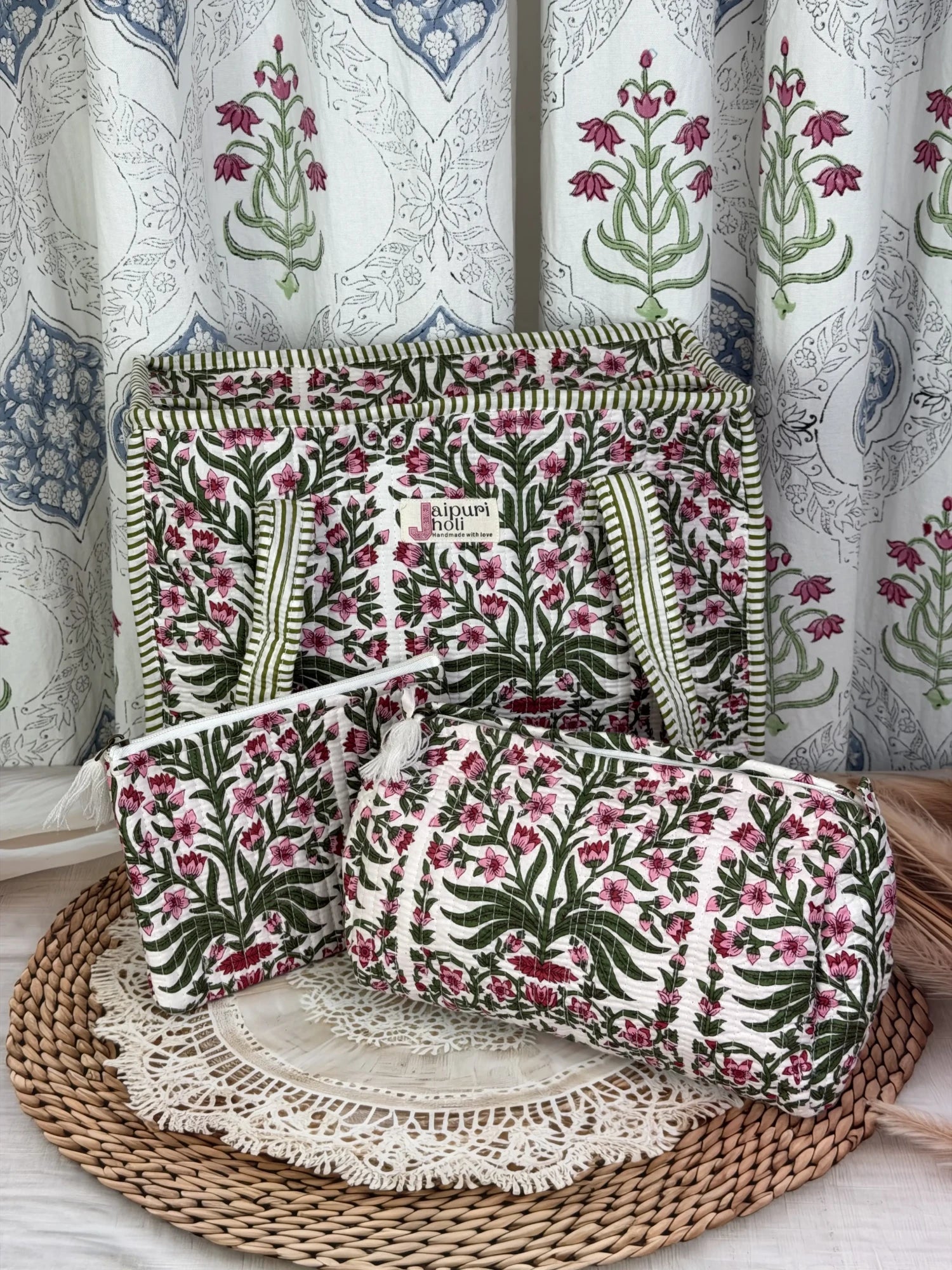 Jaipur block print medium cotton quilted zip tote bag with matching toiletry pouch and flat pouch, pink floral and green leaf print, 15 × 12 × 6 inch tote, 10 × 6 inch toiletry pouch and 9 × 7 inch flat pouch back view