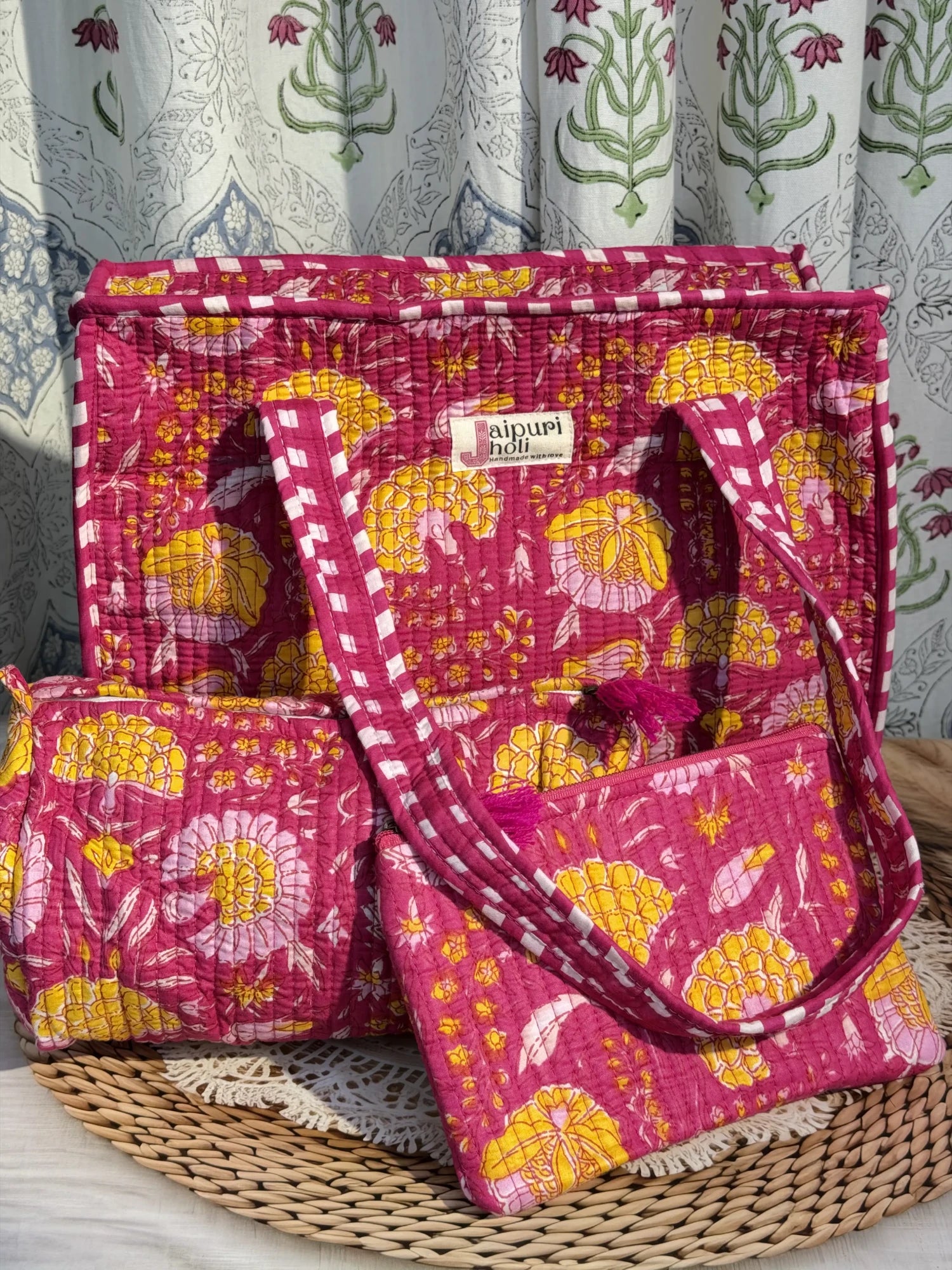 Jaipur block print medium cotton quilted zip tote bag with matching toiletry pouch and flat pouch, pink floral print, 15 × 12 × 6 inch tote, 10 × 6 inch toiletry pouch and 9 × 7 inch flat pouch back view