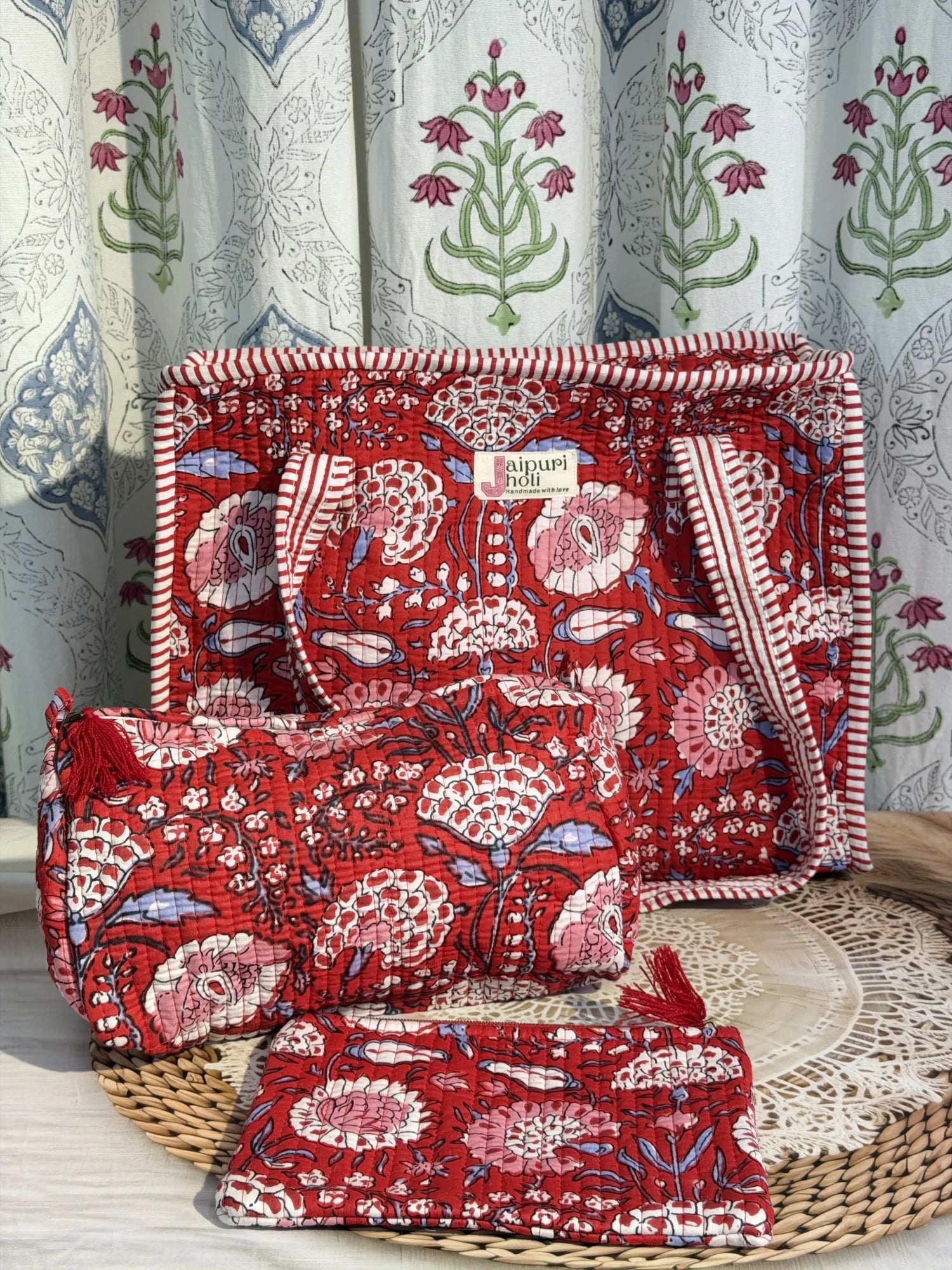Jaipur block print medium cotton quilted zip tote bag with matching toiletry pouch and flat pouch, red floral print, 15 × 12 × 6 inch tote, 10 × 6 inch toiletry pouch and 9 × 7 inch flat pouch front view