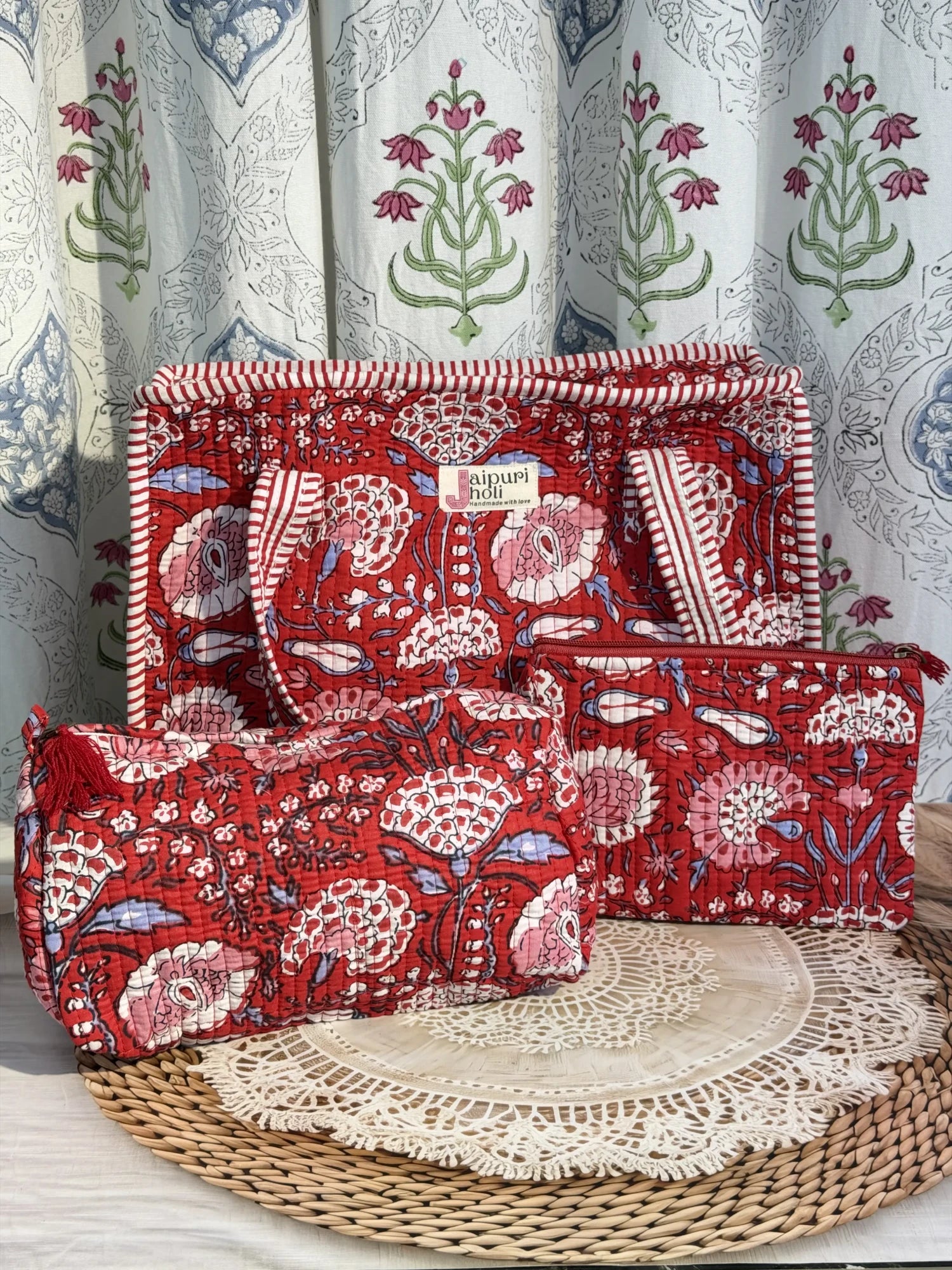 Jaipur block print medium cotton quilted zip tote bag with matching toiletry pouch and flat pouch, red floral print, 15 × 12 × 6 inch tote, 10 × 6 inch toiletry pouch and 9 × 7 inch flat pouch back view
