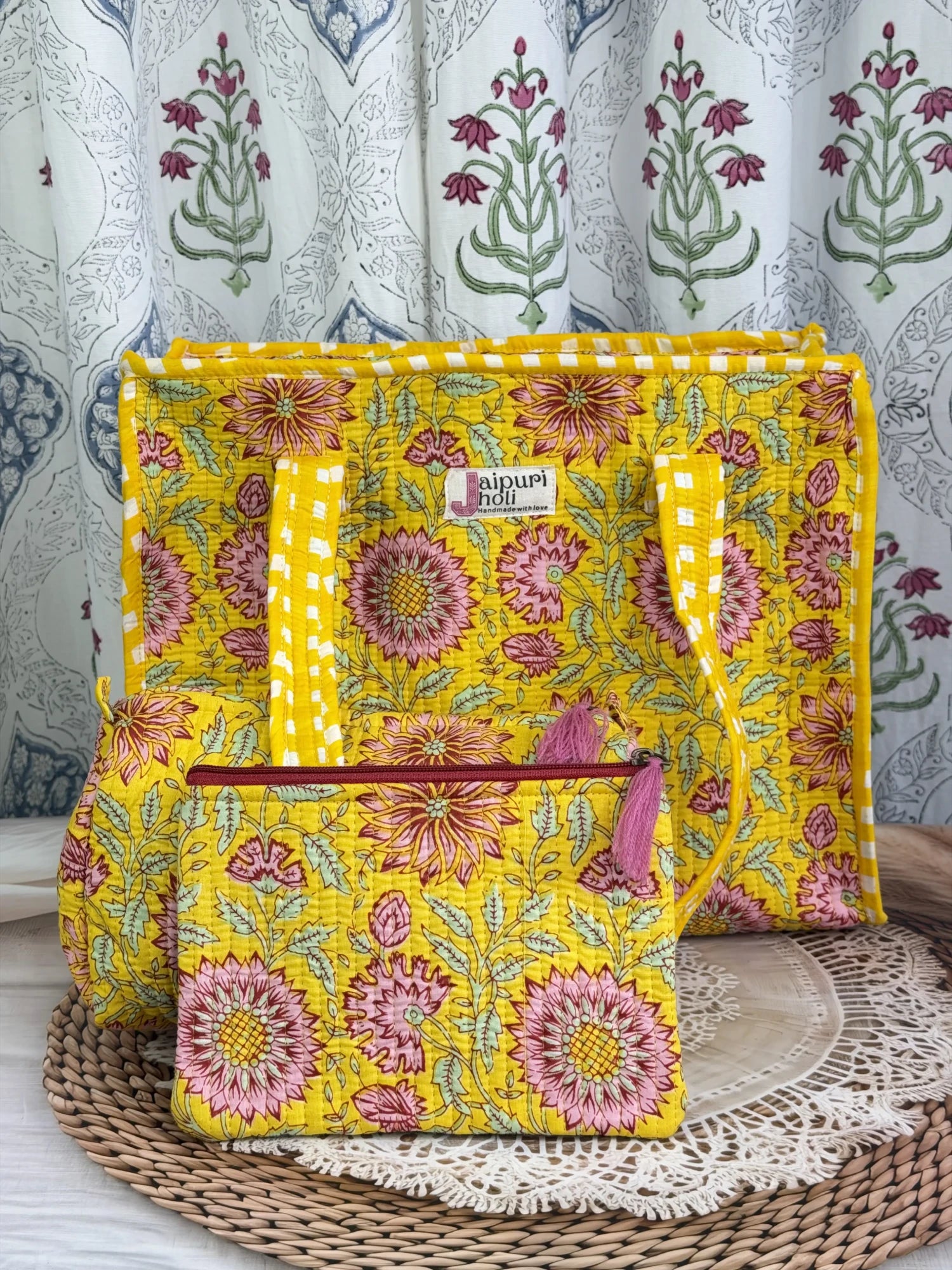 Jaipur block print medium cotton quilted zip tote bag with matching toiletry pouch and flat pouch, yellow floral print, 15 × 12 × 6 inch tote, 10 × 6 inch toiletry pouch and 9 × 7 inch flat pouch front view