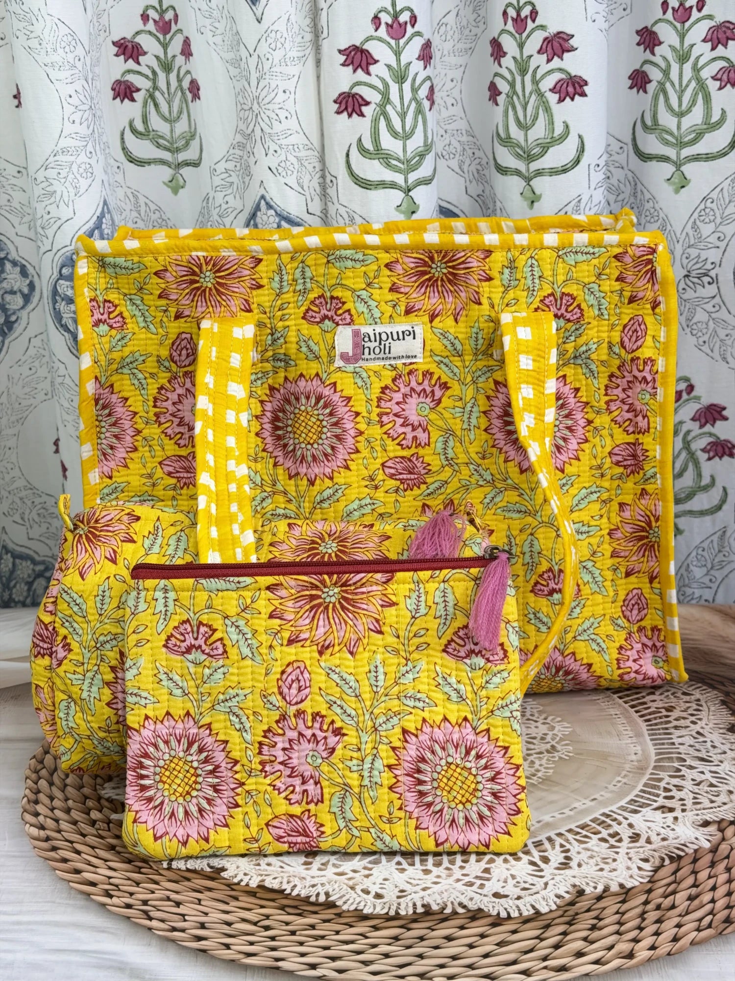 Jaipur block print medium cotton quilted zip tote bag with matching toiletry pouch and flat pouch, yellow floral print, 15 × 12 × 6 inch tote, 10 × 6 inch toiletry pouch and 9 × 7 inch flat pouch side view