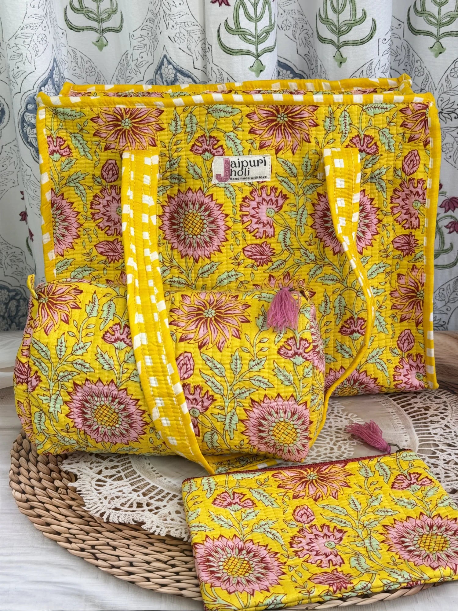 Jaipur block print medium cotton quilted zip tote bag with matching toiletry pouch and flat pouch, yellow floral print, 15 × 12 × 6 inch tote, 10 × 6 inch toiletry pouch and 9 × 7 inch flat pouch back view