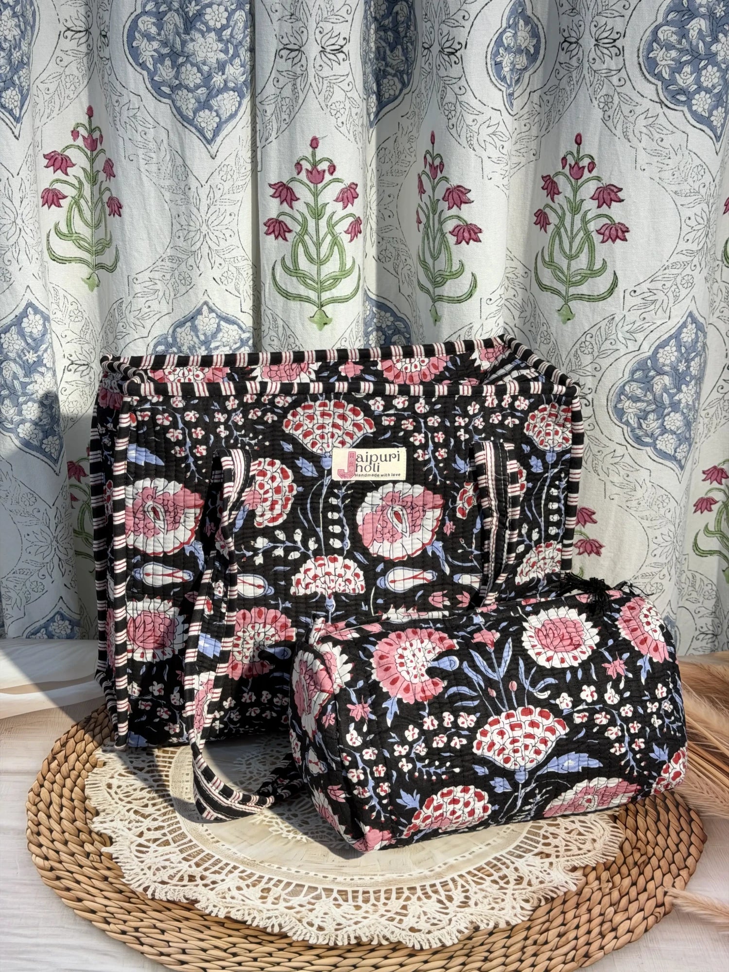 Jaipur block print cotton quilted zip tote bag with matching pouch, black and pink floral print, 15x12x6 inch tote with 10x6 inch pouch for storing cosmetics, toiletries and daily essentials side view