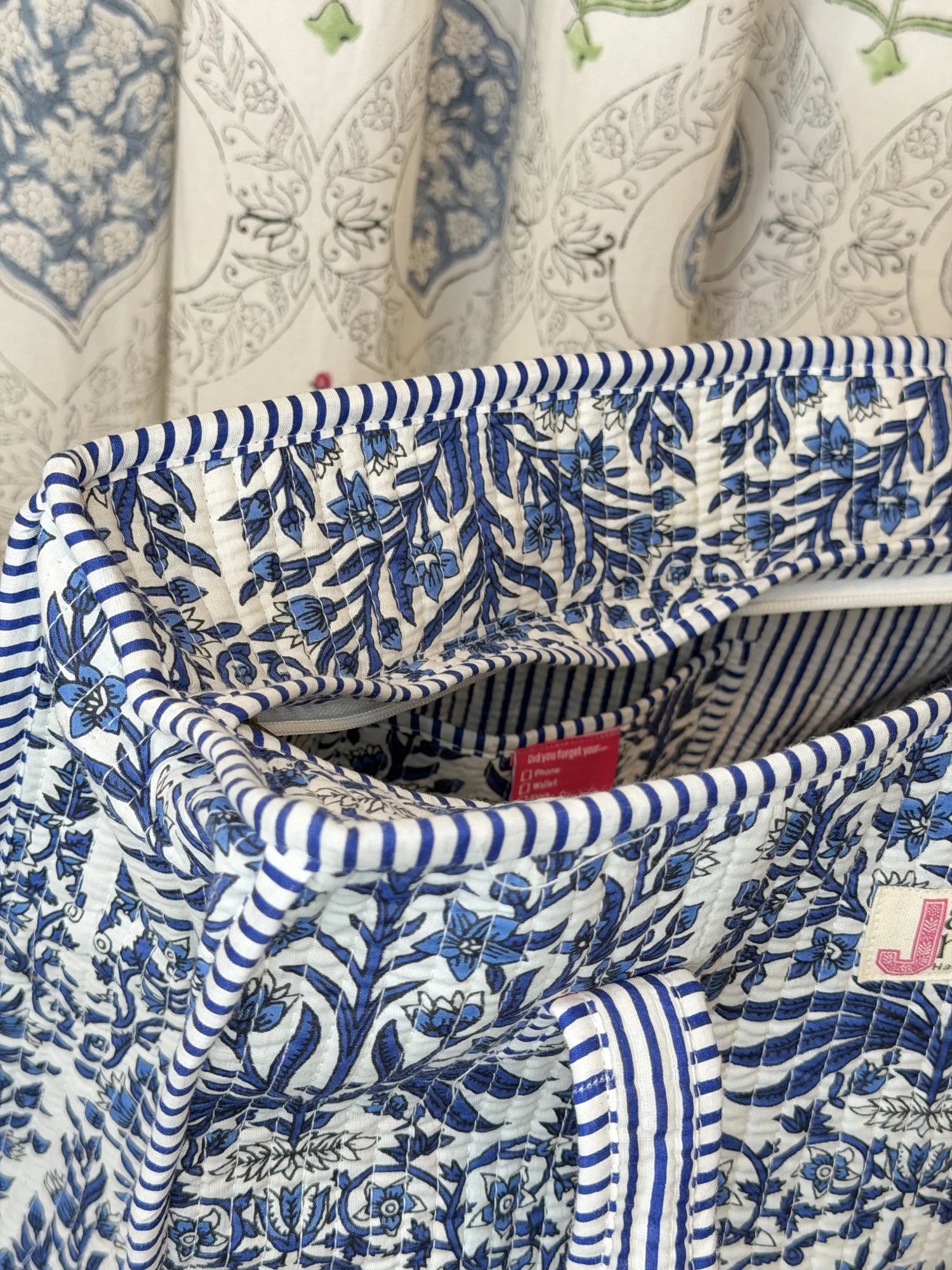 Jaipur block print cotton quilted zip tote bag with matching pouch, blue floral and leaf print, 15x12x6 inch tote with 10x6 inch pouch for keeping toiletries, cosmetics and medicines organized close-up view