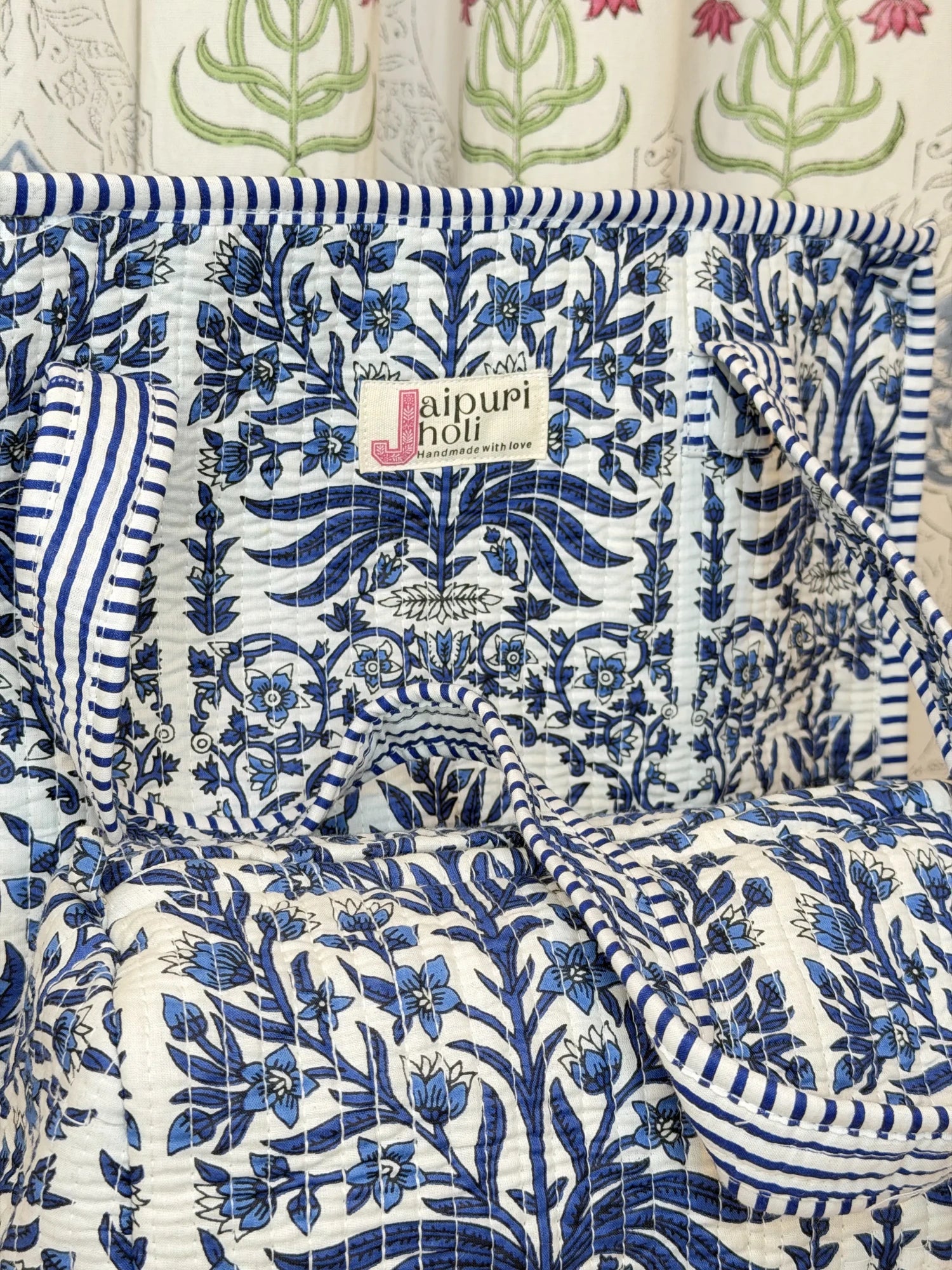 Jaipur block print cotton quilted zip tote bag with matching pouch, blue floral and leaf print, 15x12x6 inch tote with 10x6 inch pouch for keeping toiletries, cosmetics and medicines organized side view