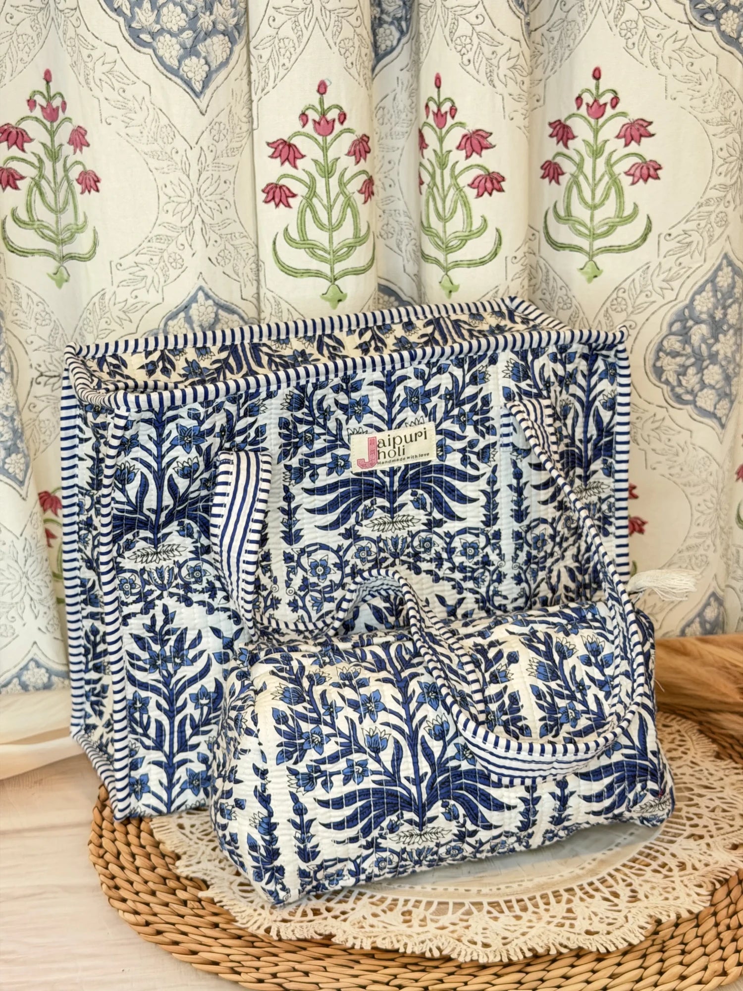 Jaipur block print cotton quilted zip tote bag with matching pouch, blue floral and leaf print, 15x12x6 inch tote with 10x6 inch pouch for keeping toiletries, cosmetics and medicines organized front view