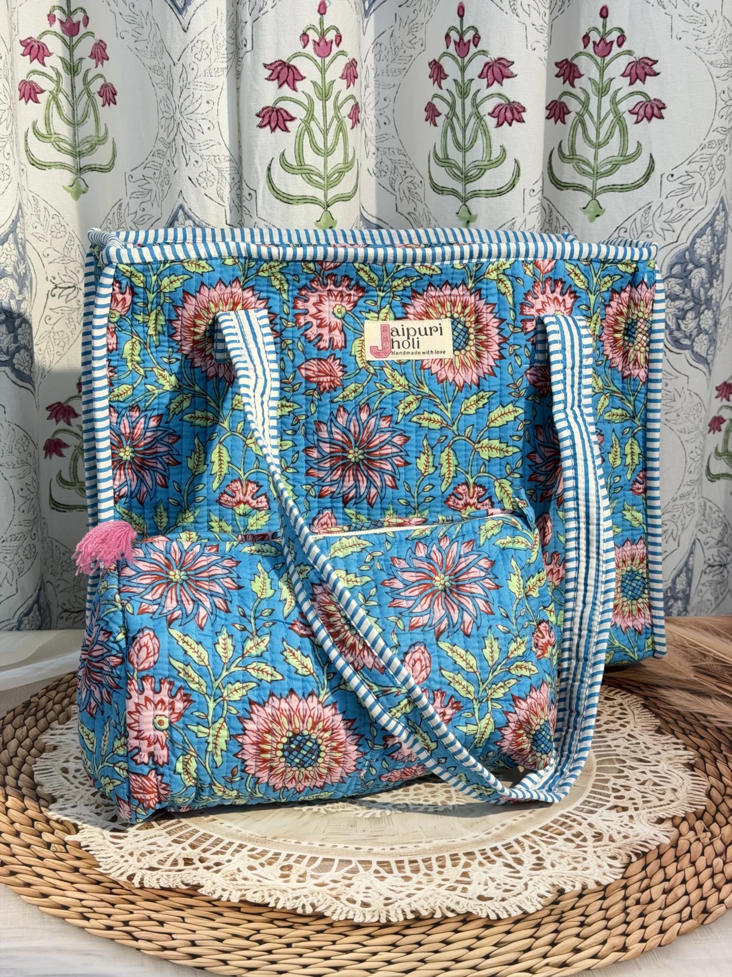 Jaipur block print cotton quilted zip tote bag with matching pouch, blue floral print, 15x12x6 inch tote with 10x6 inch pouch for organizing toiletries, cosmetics and travel items.side view