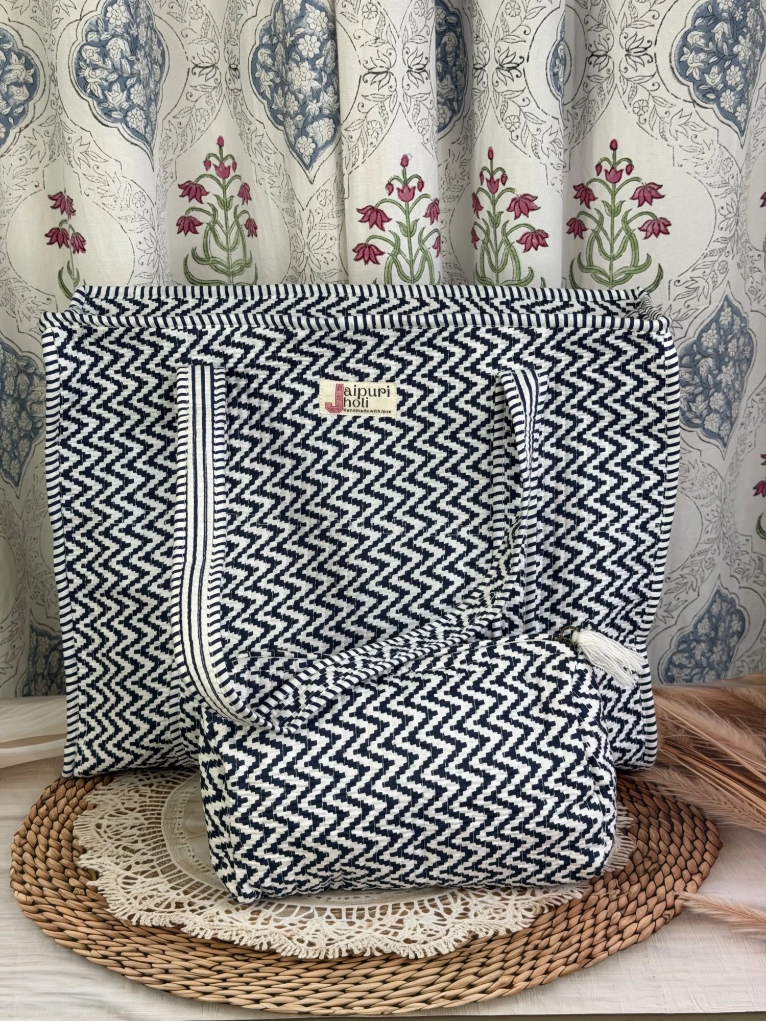 Jaipur block print cotton quilted zip tote bag with matching pouch, blue and white geometric zigzag print, 15x12x6 inch tote with 10x6 inch pouch for organizing toiletries, cosmetics and medicines during travel front view