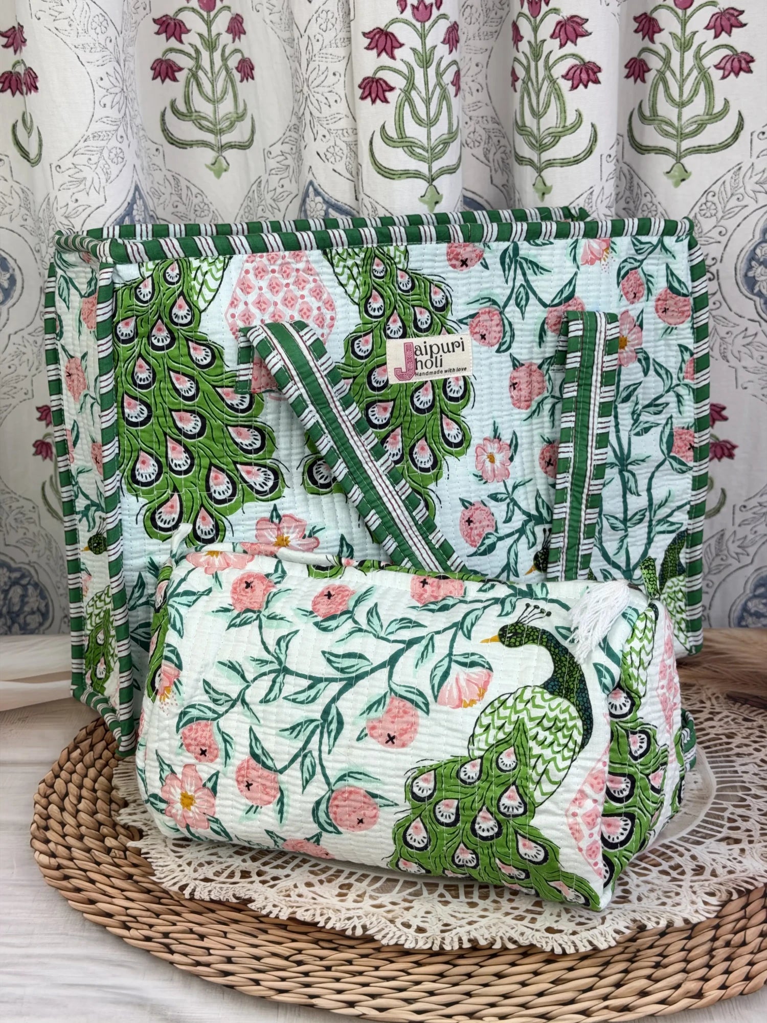 Jaipur block print cotton quilted zip tote bag with matching pouch, green and pink peacock print, 15x12x6 inch tote with 10x6 inch pouch for organizing toiletries and everyday essentials close-up view
