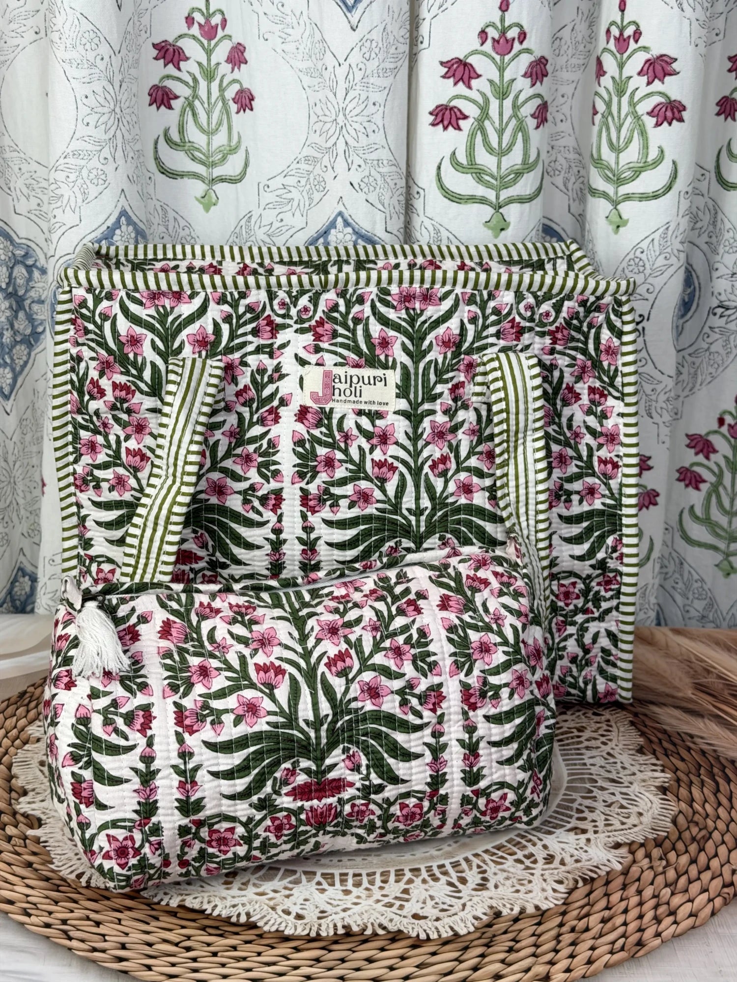 Jaipur block print cotton quilted zip tote bag with matching pouch, pink floral and green leaf print, 15x12x6 inch tote with 10x6 inch pouch for storing toiletries and travel essentials front view