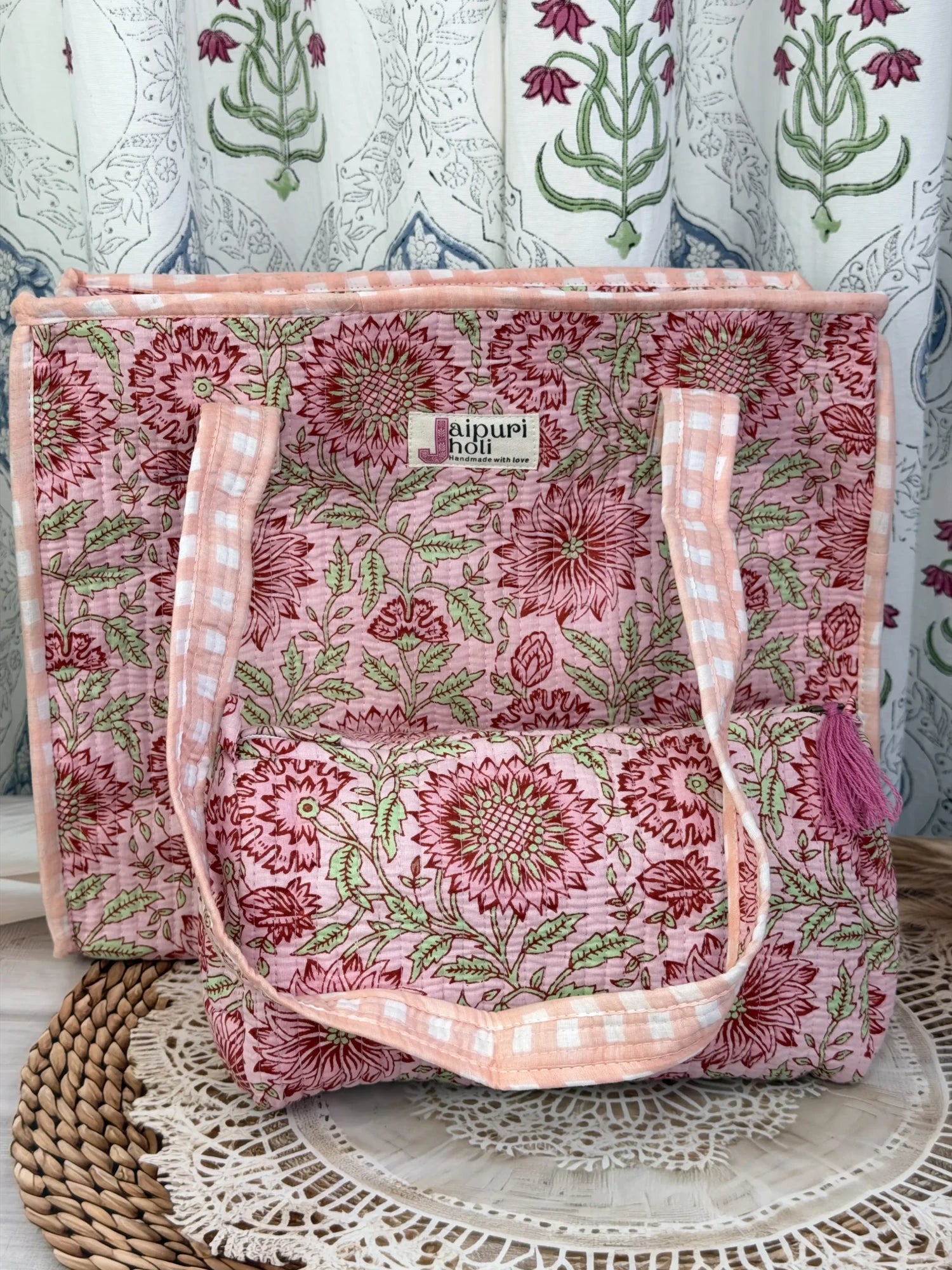 Jaipur block print cotton quilted zip tote bag with matching pouch, peach and pink floral print, 15x12x6 inch tote with 10x6 inch pouch for keeping toiletries and cosmetics together front  view
