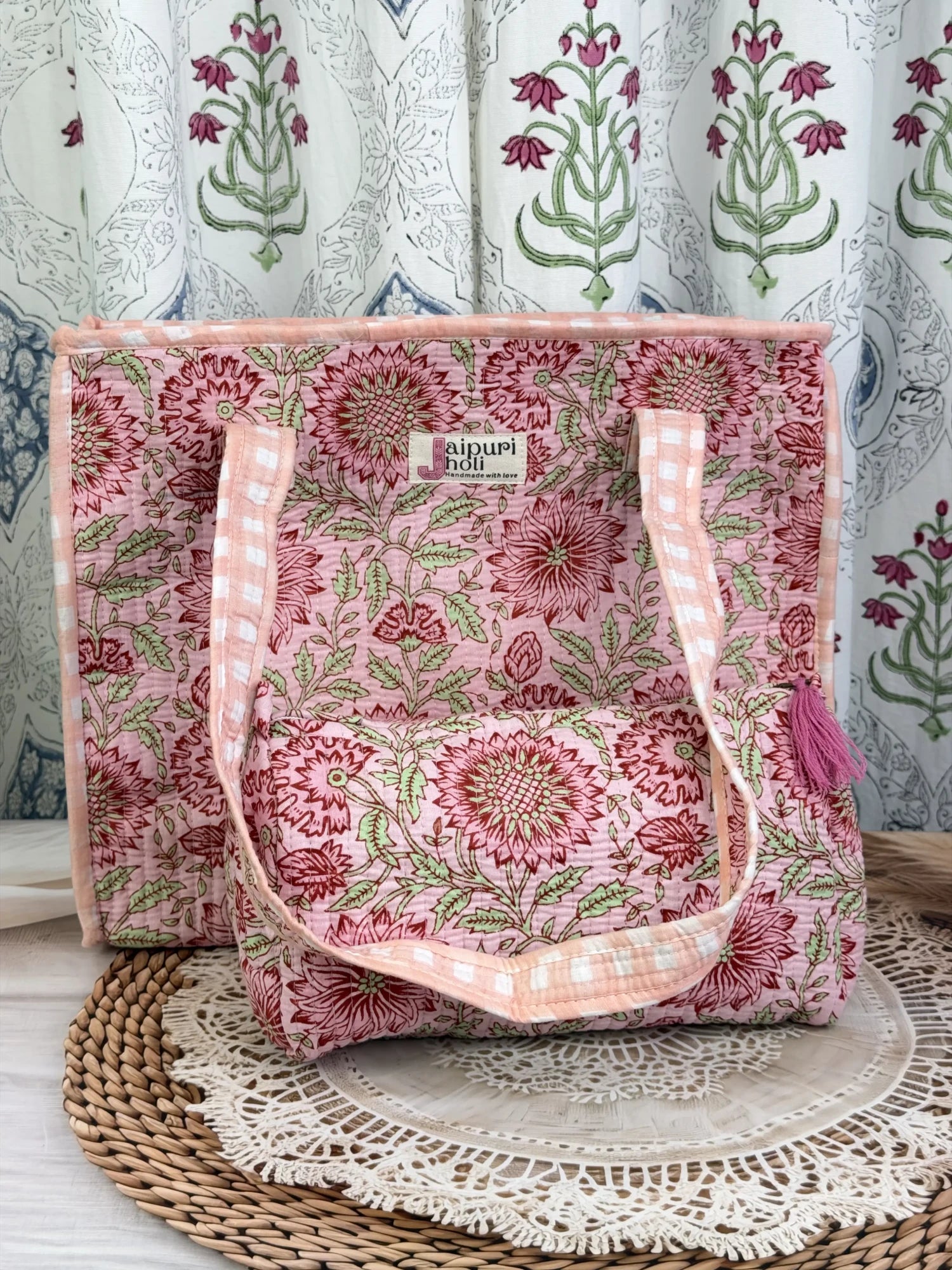 Jaipur block print cotton quilted zip tote bag with matching pouch, peach and pink floral print, 15x12x6 inch tote with 10x6 inch pouch for keeping toiletries and cosmetics together close-up view