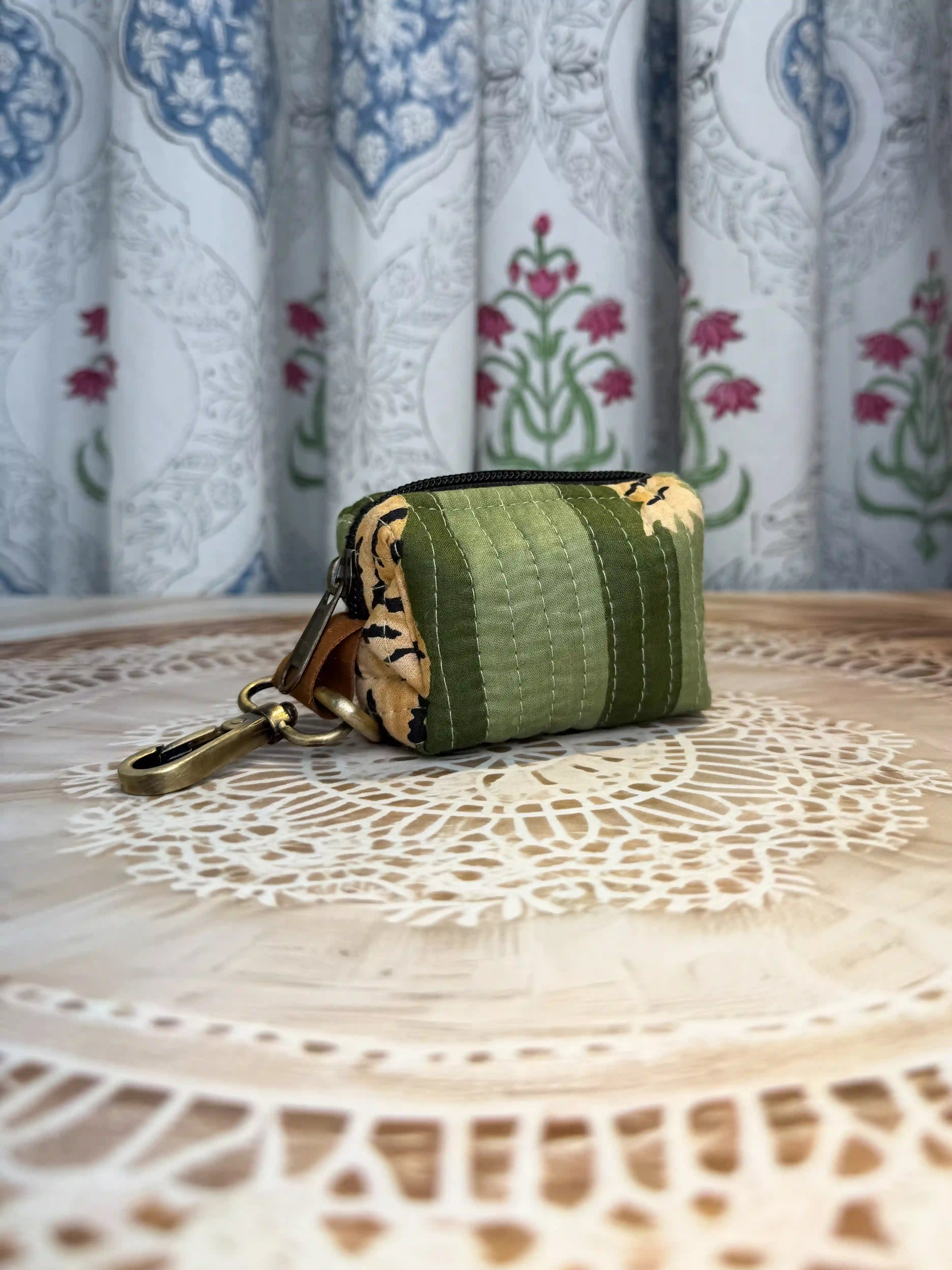 Trending tiger print green quilted cotton keychain pouch with yellow and black hand block tiger stripes, features durable zipper and brass keyring for keys and coins.