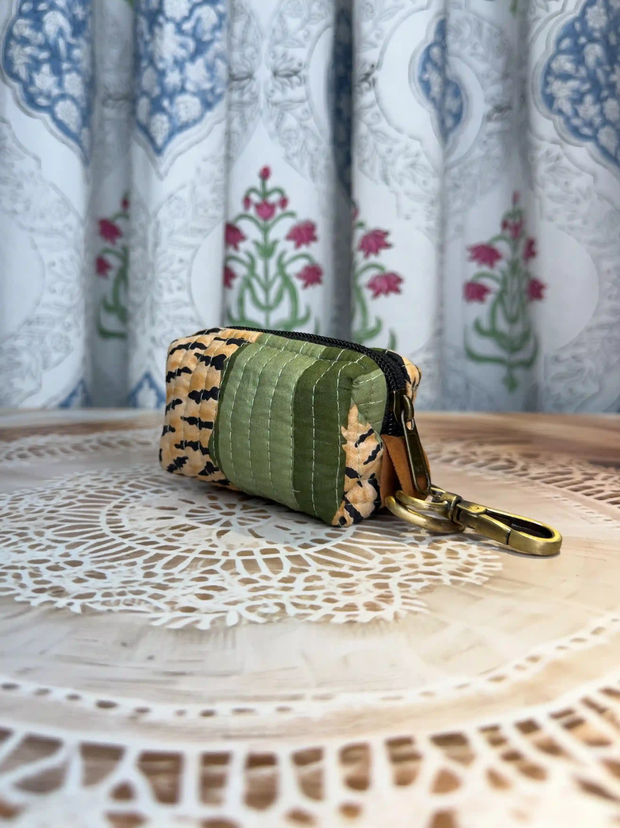 Trending tiger print green quilted cotton keychain pouch with yellow and black hand block tiger stripes, features durable zipper and brass keyring for keys and coins.